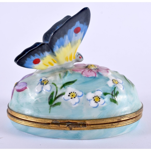 81 - A FRENCH LIMOGES PORCELAIN BUTTERFLY PILL BOX AND COVER. 9.5 cm x 8.5 cm.