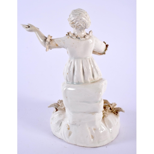 83 - AN 18TH CENTURY CONTINENTAL CREAMWARE TYPE FIGUE modelled as a female holding a letter. 11.5 cm high... 