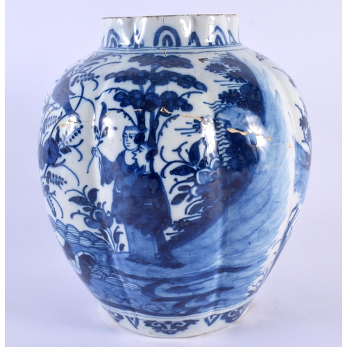 90 - AN 18TH CENTURY DUTCH DELFT RIBBED BLUE AND WHITE POTTERY VASE painted with Oriental figures within ... 