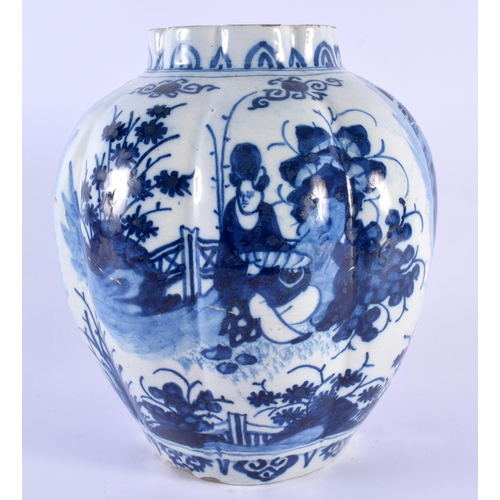 90 - AN 18TH CENTURY DUTCH DELFT RIBBED BLUE AND WHITE POTTERY VASE painted with Oriental figures within ... 