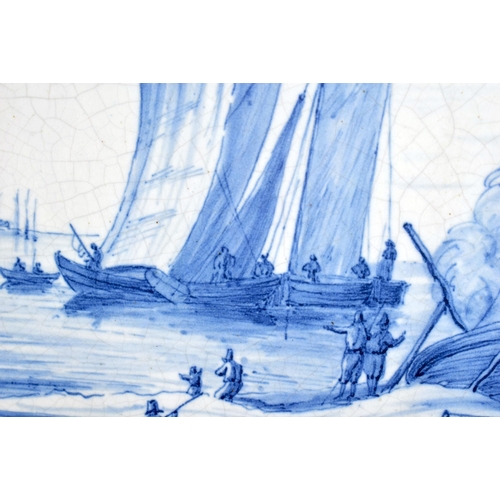 91 - A LARGE DUTCH DELFT POTTERY BLUE AND WHITE PLAQUE painted with boating scenes. 36 cm x 28 cm.