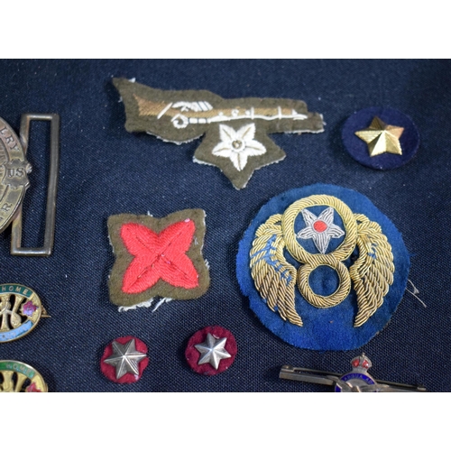 3086 - A US 7th Cavalry belt buckle together with another buckle together with a collection of badges and m... 