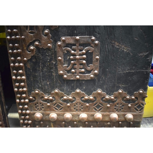 3998 - A huge pair of Chinese Iron bound and studded wooden garden gate doors 203 x 66 cm (one Door) .