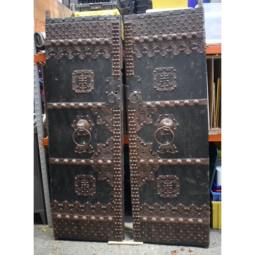 3998 - A huge pair of Chinese Iron bound and studded wooden garden gate doors 203 x 66 cm (one Door) .