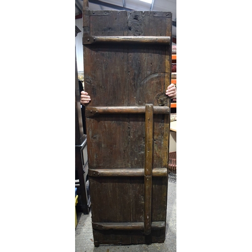 3998 - A huge pair of Chinese Iron bound and studded wooden garden gate doors 203 x 66 cm (one Door) .