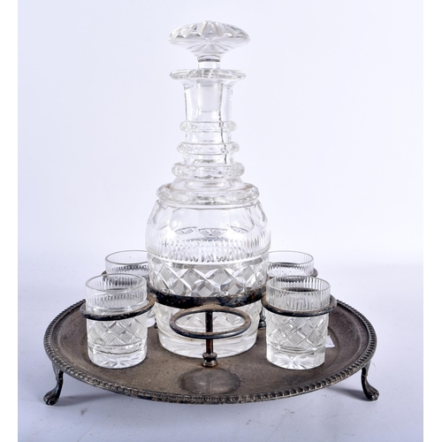 100 - AN EDWARDIAN SILVER PLATED DECANTER HOLDER containing George III cut glass wares. 22 cm x 15cm.