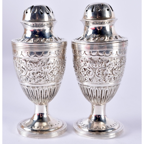 106 - A Pair of Victorian Silver Condiments.  Hallmarked London 1886.  9.5cm x 4cm, total weight 105.2g (2... 