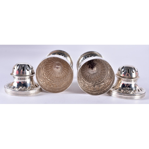 106 - A Pair of Victorian Silver Condiments.  Hallmarked London 1886.  9.5cm x 4cm, total weight 105.2g (2... 