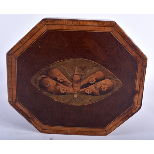 12 - AN UNUSUAL GEORGE III MAHOGANY HEXAGONAL TEA CADDY with walnut banding, the top decorated with a mot... 