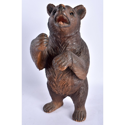 131 - A LARGE 19TH CENTURY BAVARIAN BLACK FOREST CARVED WOOD FIGURE OF A BEAR modelled with hands raised a... 