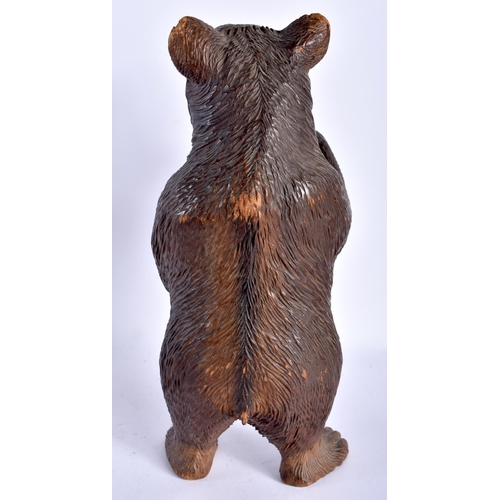 131 - A LARGE 19TH CENTURY BAVARIAN BLACK FOREST CARVED WOOD FIGURE OF A BEAR modelled with hands raised a... 