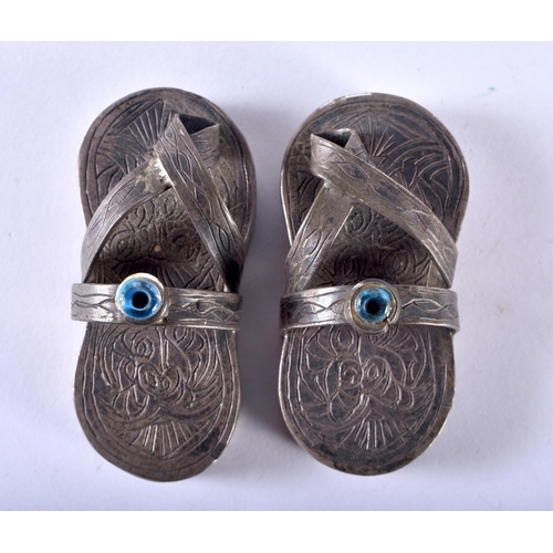 138 - An Unusual Pair of Sterling Silver Sandals.  XRF Tested for purity.  5.7cm x 2.5cm x 2.5cm, weight 7... 