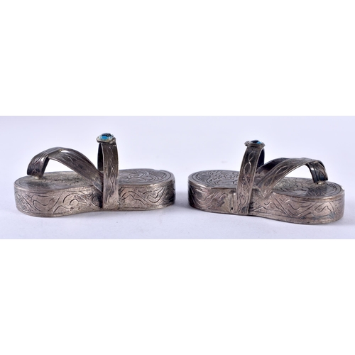 138 - An Unusual Pair of Sterling Silver Sandals.  XRF Tested for purity.  5.7cm x 2.5cm x 2.5cm, weight 7... 