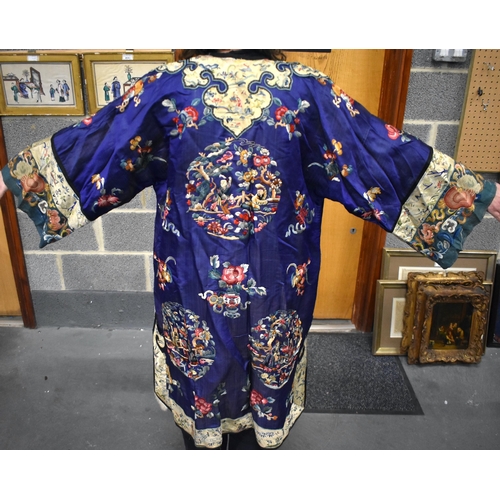 144 - A FINE 19TH CENTURY CHINESE SILK EMBROIDERED ROBE Qing, decorated all over with flowers and assorted... 