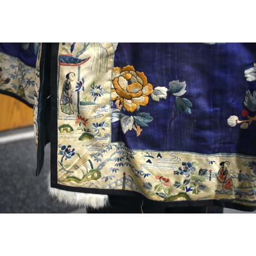 144 - A FINE 19TH CENTURY CHINESE SILK EMBROIDERED ROBE Qing, decorated all over with flowers and assorted... 