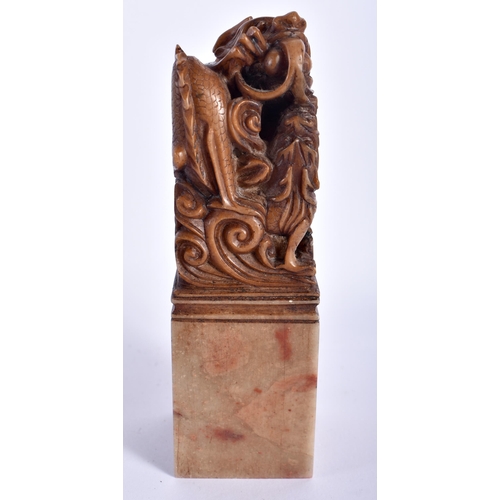 18 - AN EARLY 20TH CENTURY CHINESE CARVED SOAPSTONE DRAGON SEAL Late Qing. 12 cm high.