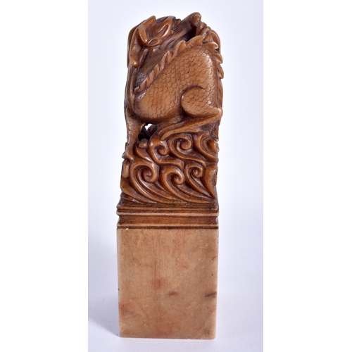 18 - AN EARLY 20TH CENTURY CHINESE CARVED SOAPSTONE DRAGON SEAL Late Qing. 12 cm high.