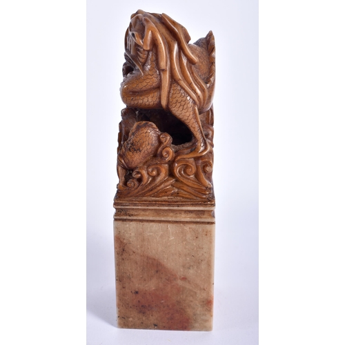 18 - AN EARLY 20TH CENTURY CHINESE CARVED SOAPSTONE DRAGON SEAL Late Qing. 12 cm high.