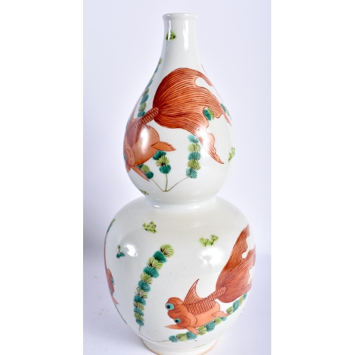 19 - AN UNUSUAL 19TH CENTURY CHINESE GOURD FORM PORCELAIN VASE Qing, painted with goldfish swimming among... 