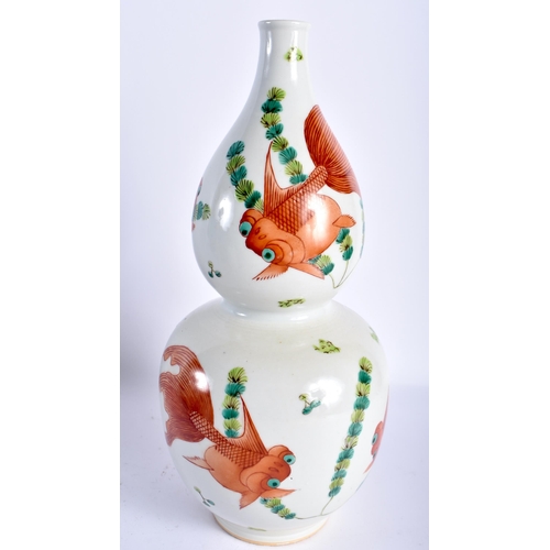 19 - AN UNUSUAL 19TH CENTURY CHINESE GOURD FORM PORCELAIN VASE Qing, painted with goldfish swimming among... 