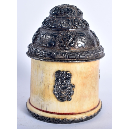 35 - A 19TH CENTURY TIBETAN SILVER MOUNTEE BONE SCHOLARS OBJECT decorated with foliage. 9 cm x 5 cm.