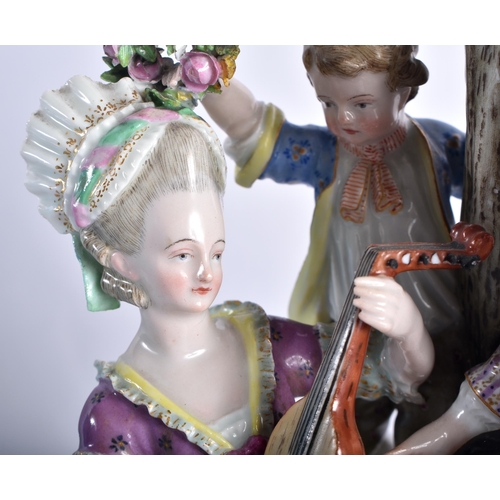 42 - A LARGE 19TH CENTURY MEISSEN PORCELAIN FIGURAL GROUP modelled as a cavalier beside a female playing ... 