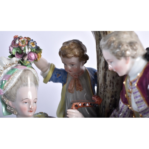 42 - A LARGE 19TH CENTURY MEISSEN PORCELAIN FIGURAL GROUP modelled as a cavalier beside a female playing ... 