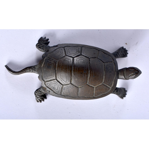 47 - A 19TH CENTURY JAPANESE MEIJI PERIOD BRONZE TORTOISE OKIMONO modelled roaming. 10 cm wide.