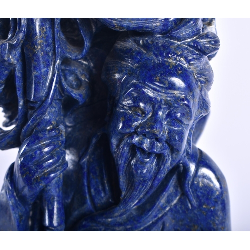 49 - A LARGE EARLY 20TH CENTURY CHINESE CARVED LAPIS LAZULI FIGURE OF A FISHERMAN Late Qing/Republic. 34 ... 