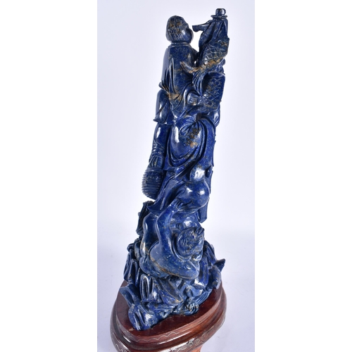 49 - A LARGE EARLY 20TH CENTURY CHINESE CARVED LAPIS LAZULI FIGURE OF A FISHERMAN Late Qing/Republic. 34 ... 