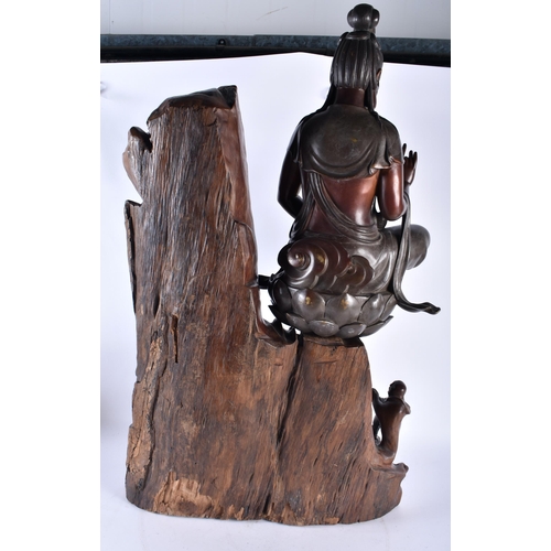 627 - A VERY LARGE AND UNUSUAL 19TH CENTURY CHINESE BRONZE AND ROOTWOOD SCULPTURE formed with Quanyin seat... 