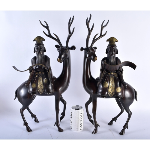 628 - A VERY LARGE PAIR OF 19TH CENTURY CHINESE BRONZE STAG CENSERS AND COVERS formed with scholars highli... 