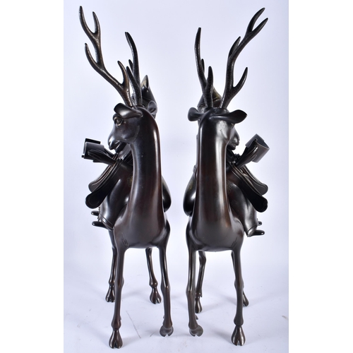 628 - A VERY LARGE PAIR OF 19TH CENTURY CHINESE BRONZE STAG CENSERS AND COVERS formed with scholars highli... 