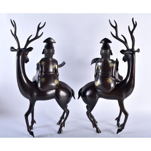 628 - A VERY LARGE PAIR OF 19TH CENTURY CHINESE BRONZE STAG CENSERS AND COVERS formed with scholars highli... 