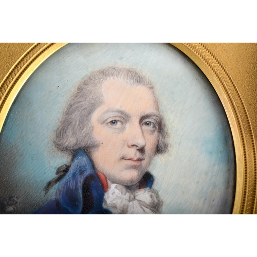 63 - English School (18th/19th Century) Portrait Miniature, Male wearing a dark blue overcoat, gilt bronz... 