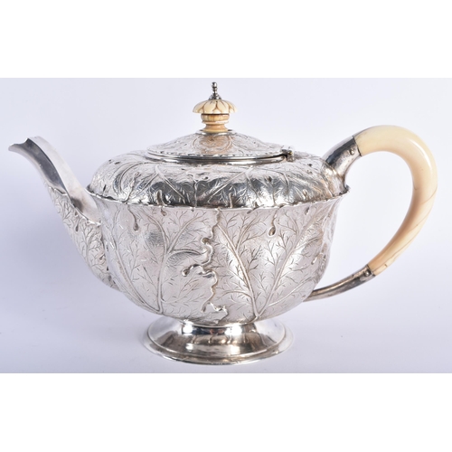 630 - A FINE ART NOUVEAU CABBAGE LEAF SILVER TEAPOT AND COVER by the Guild of Handicrafts. London 1911. 73... 