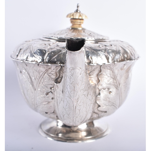 630 - A FINE ART NOUVEAU CABBAGE LEAF SILVER TEAPOT AND COVER by the Guild of Handicrafts. London 1911. 73... 