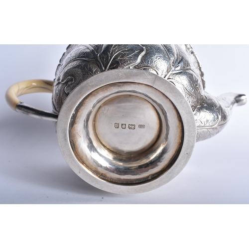 630 - A FINE ART NOUVEAU CABBAGE LEAF SILVER TEAPOT AND COVER by the Guild of Handicrafts. London 1911. 73... 