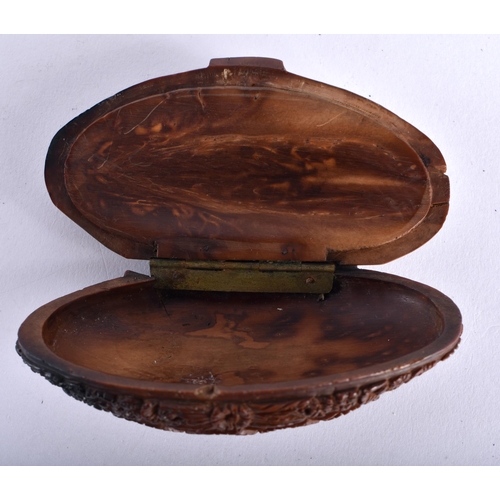 631 - AN 18TH CENTURY FRENCH CARVED COQUILLA NUT SNUFF BOX decorated with a central sailor seated drinking... 