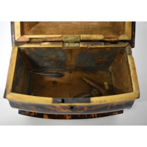 8 - AN EARLY REGENCY CARVED TORTOISESHELL TEA CADDY of shaped form, with recessed body and wire work inl... 