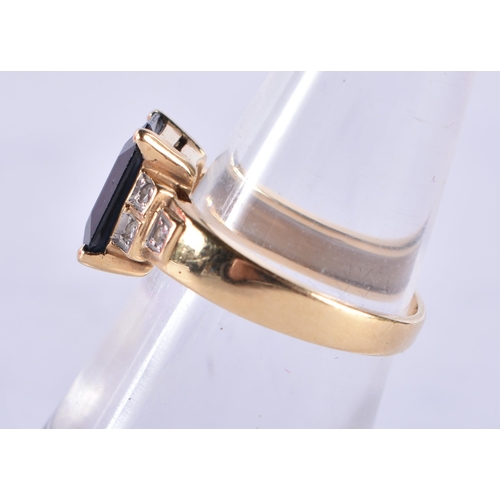 867 - An 18 Ct Gold Ring set with a Blue Sapphire with diamond shoulder.  Size M, weight 4.5g