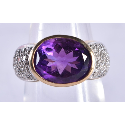 868 - An 9 Ct Gold Ring set with an Amethyst with diamond shoulder.  Size M, weight 5.61g