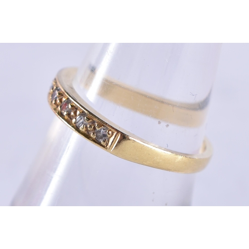 869 - An 18 Ct Gold ring set with Diamonds.  Size N, weight 2.67g