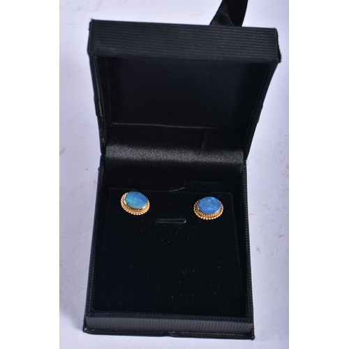 870 - A Pair of 9 Ct Gold Earrings set with an Opal.  Weight 2.63g