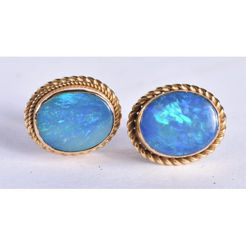 870 - A Pair of 9 Ct Gold Earrings set with an Opal.  Weight 2.63g