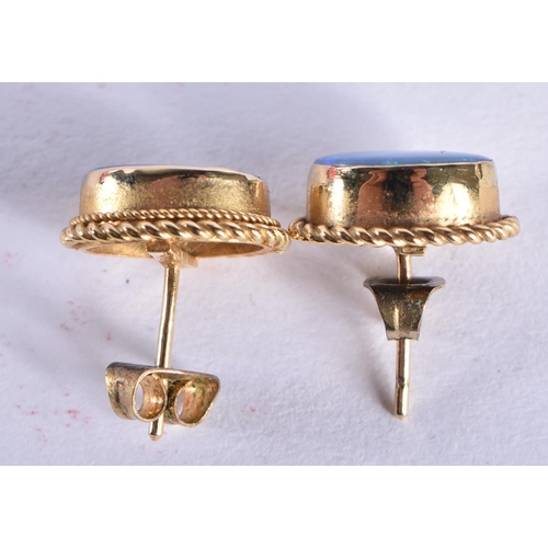 870 - A Pair of 9 Ct Gold Earrings set with an Opal.  Weight 2.63g