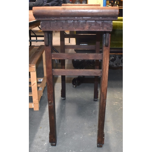 125B - A 19TH CENTURY CHINESE CARVED HARDWOOD ALTAR TABLE Qing, formed with assorted motifs. 100 cm x 34 cm... 