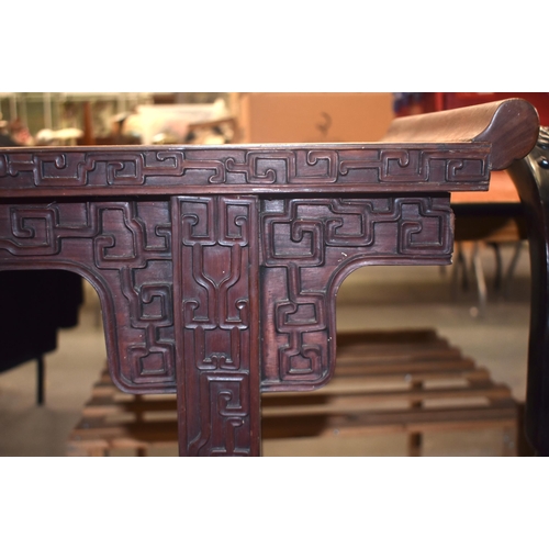 125B - A 19TH CENTURY CHINESE CARVED HARDWOOD ALTAR TABLE Qing, formed with assorted motifs. 100 cm x 34 cm... 