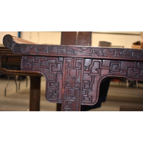 125B - A 19TH CENTURY CHINESE CARVED HARDWOOD ALTAR TABLE Qing, formed with assorted motifs. 100 cm x 34 cm... 