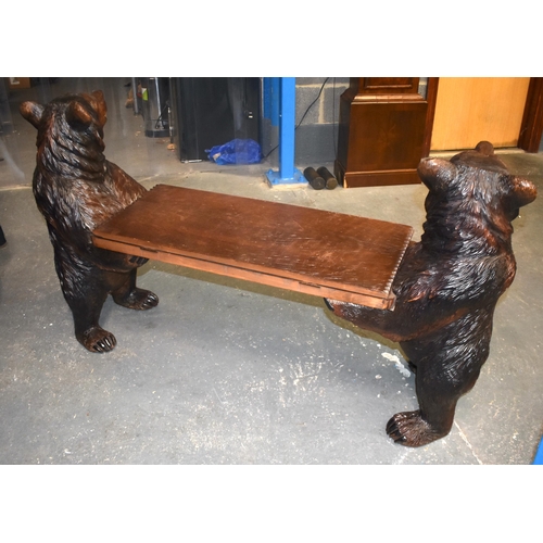 125E - A RARE LARGE 19TH CENTURY BAVARIAN BLACK FOREST CARVED WOOD MUSICAL HALL BENCH formed with two whims... 